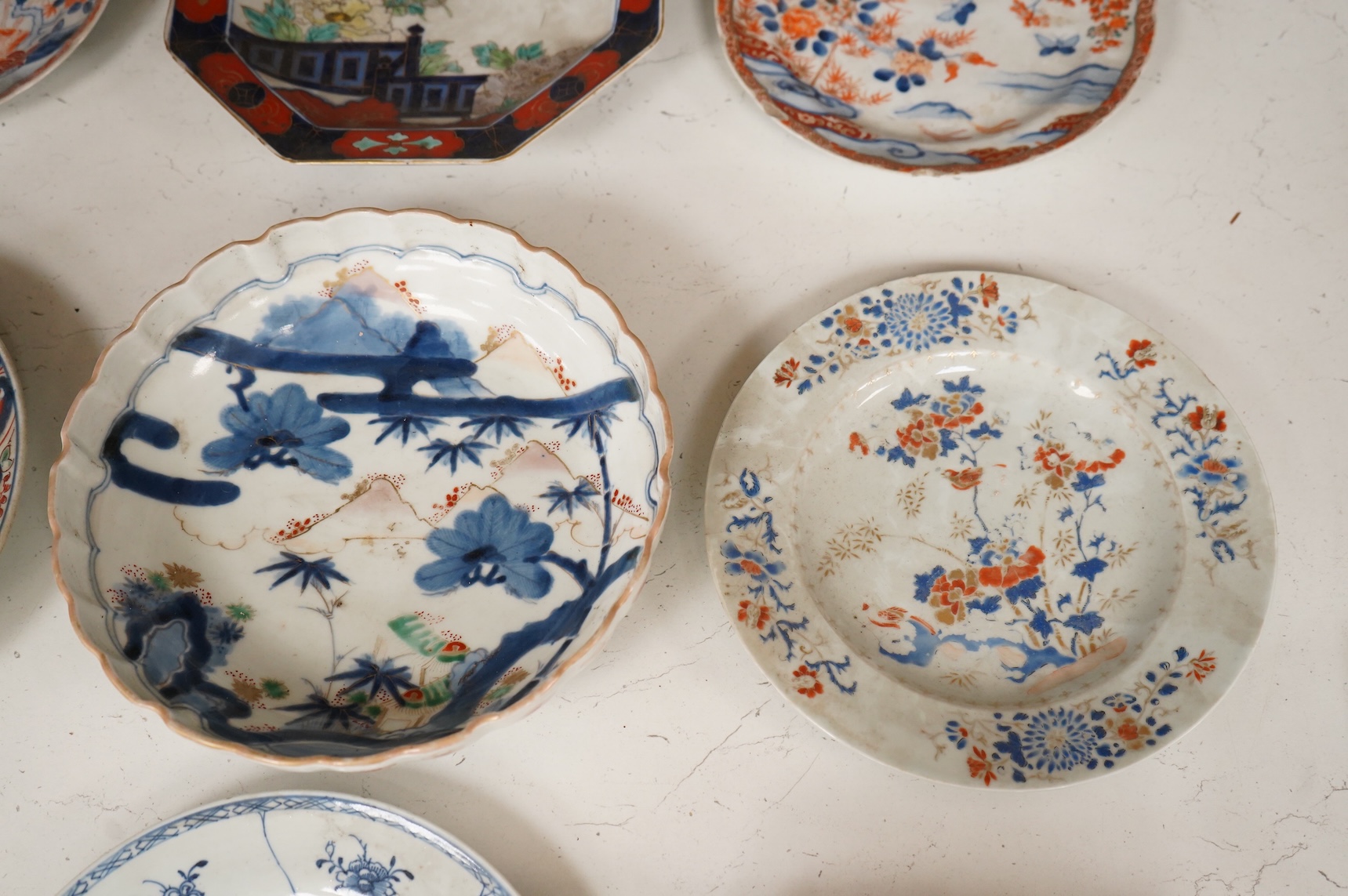 Six 19th century Japanese plates and a bowl, mostly Imari pattern, the octagonal dish with Koransha mark for Fukagawa, largest 24cm in diameter